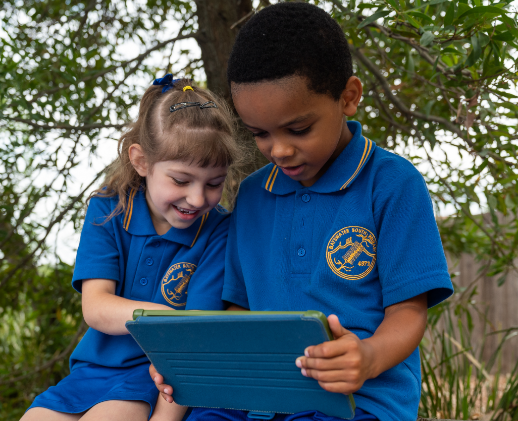 Boy And Girl Using App Outside